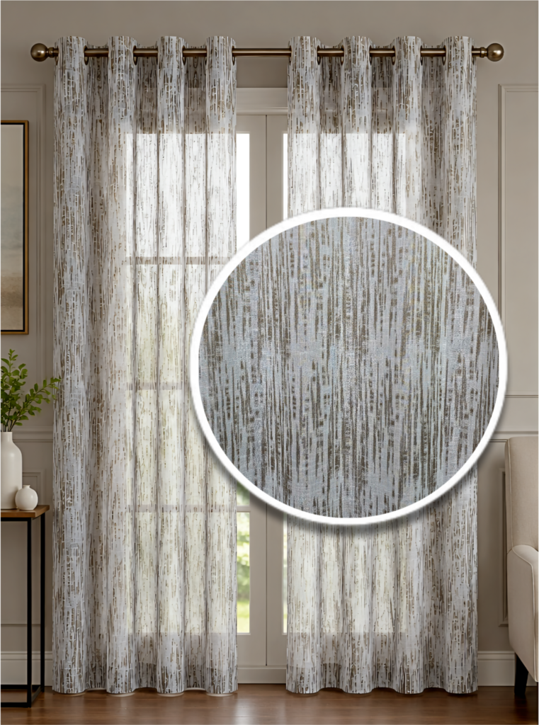 Modern off-white sheer curtains with a grey and taupe distressed vertical stripe pattern hanging from a bronze grommet rod